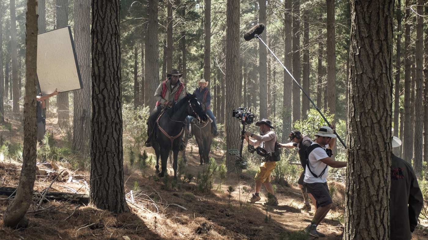 The Black Beauty camera team filming Hakeem Kae-Kazim riding through the forest